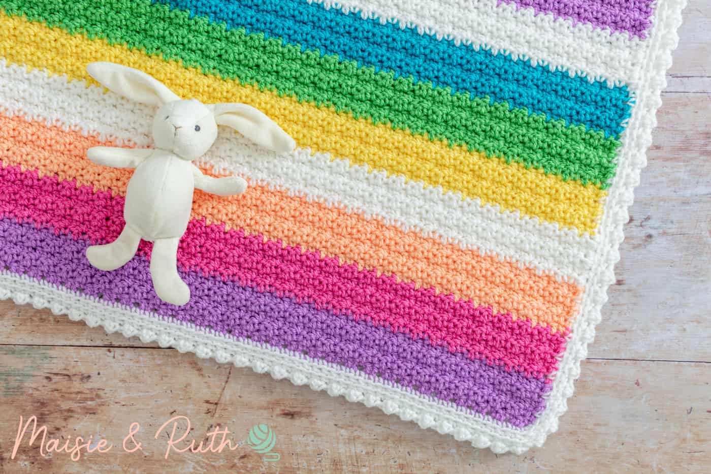 How to Crochet a Baby Blanket Flatlay on wood