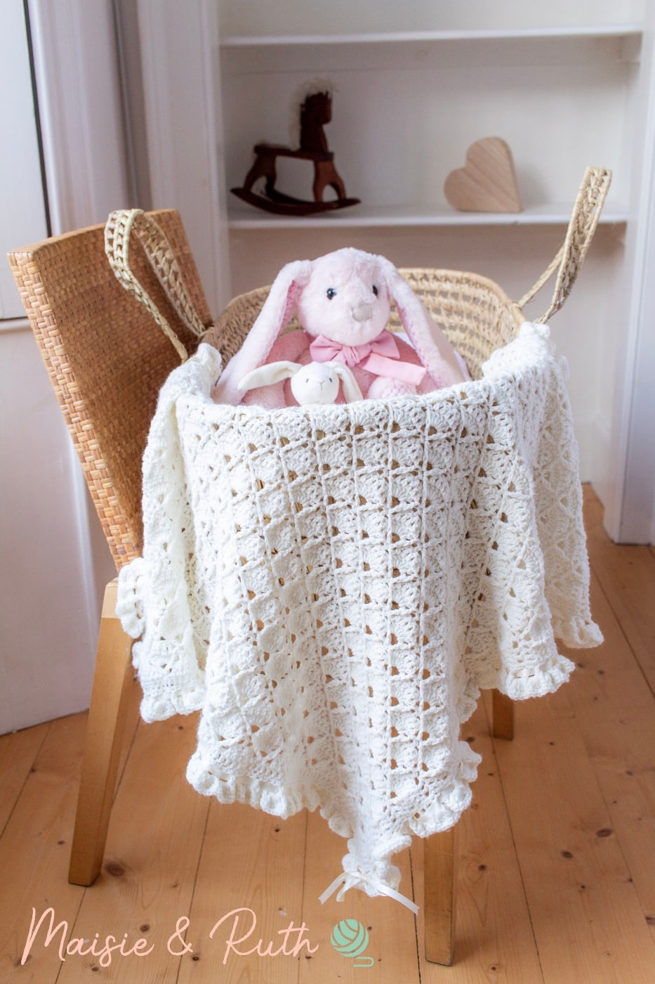 Crochet Baby Blanket Pattern in bassinet with bunny