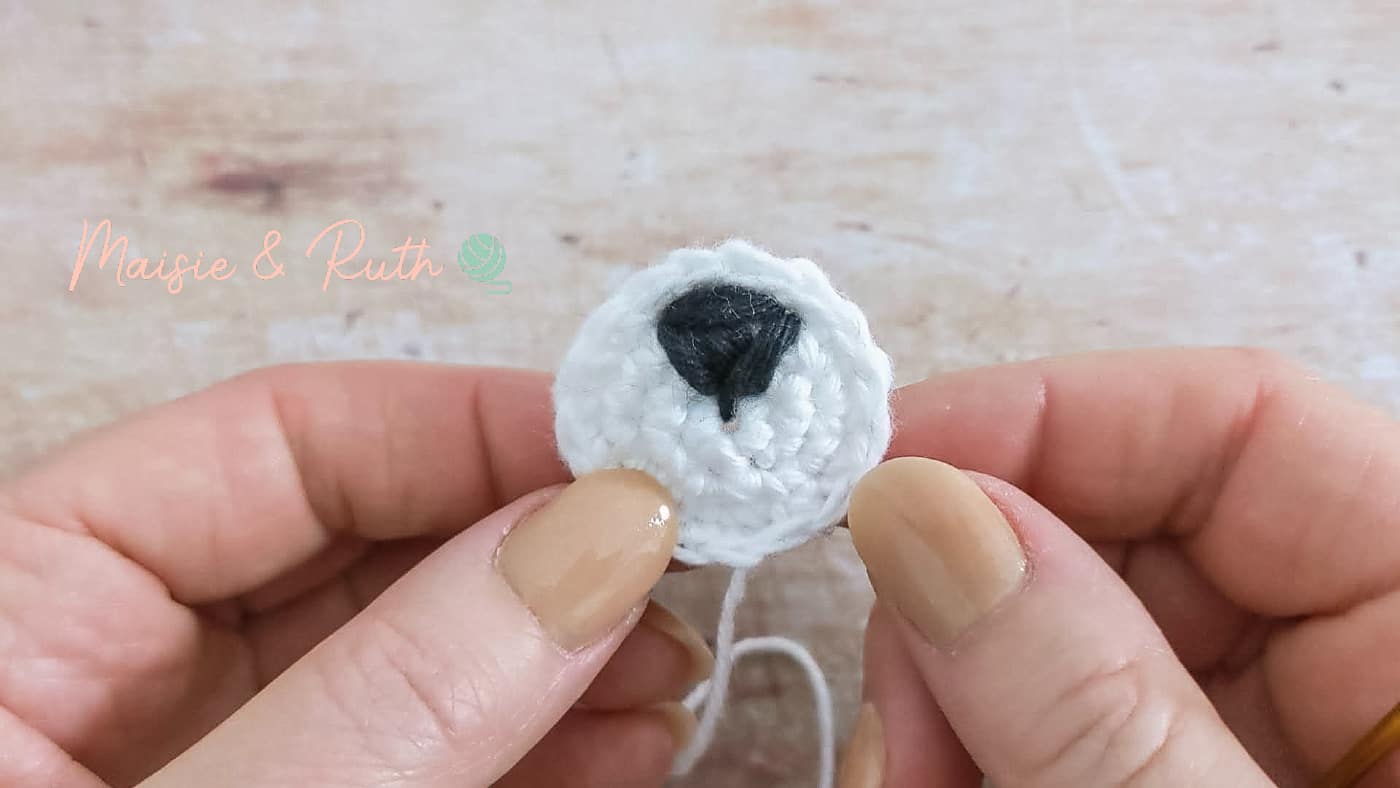 How to Crochet a Baby Rattle embroider nose