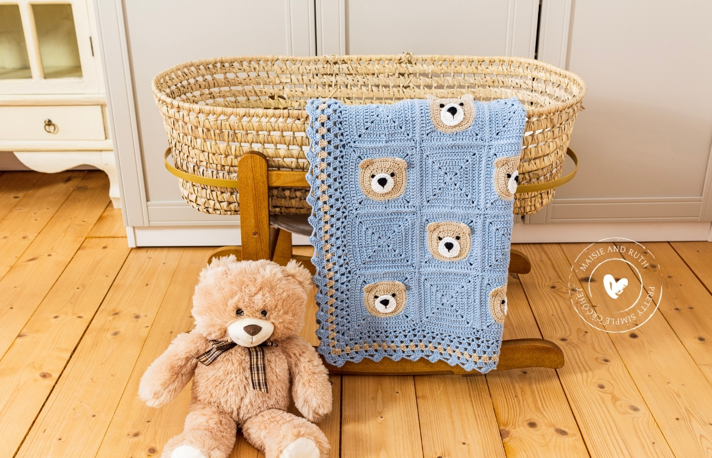 Bear Crochet Baby Blanket Teddy on floor beside bassinet