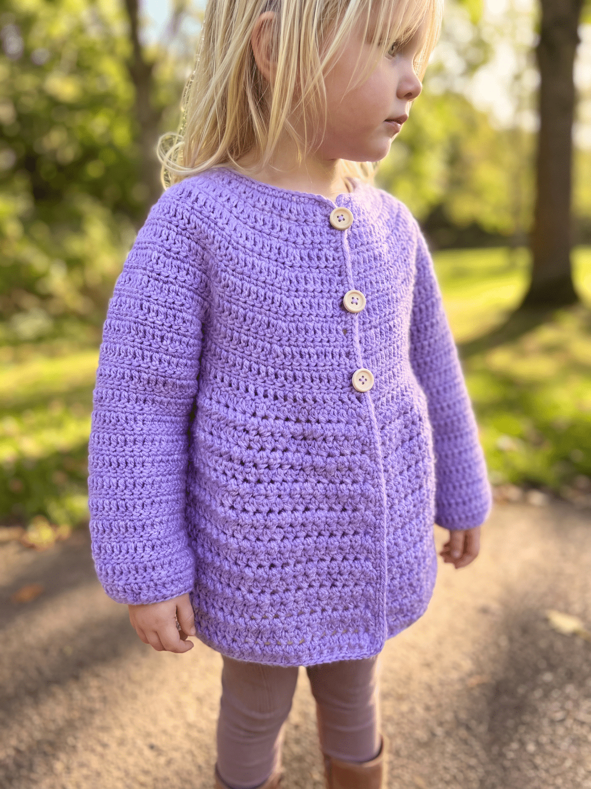 Crochet baby cardigan pattern with top down construction and textured body