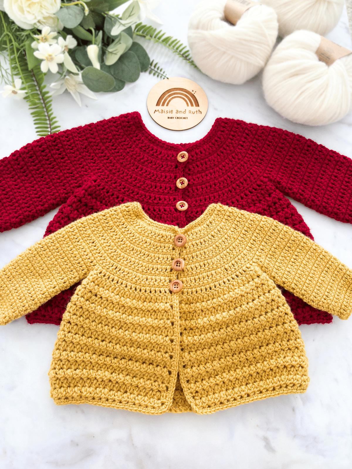 Crochet baby cardigan pattern styled flat