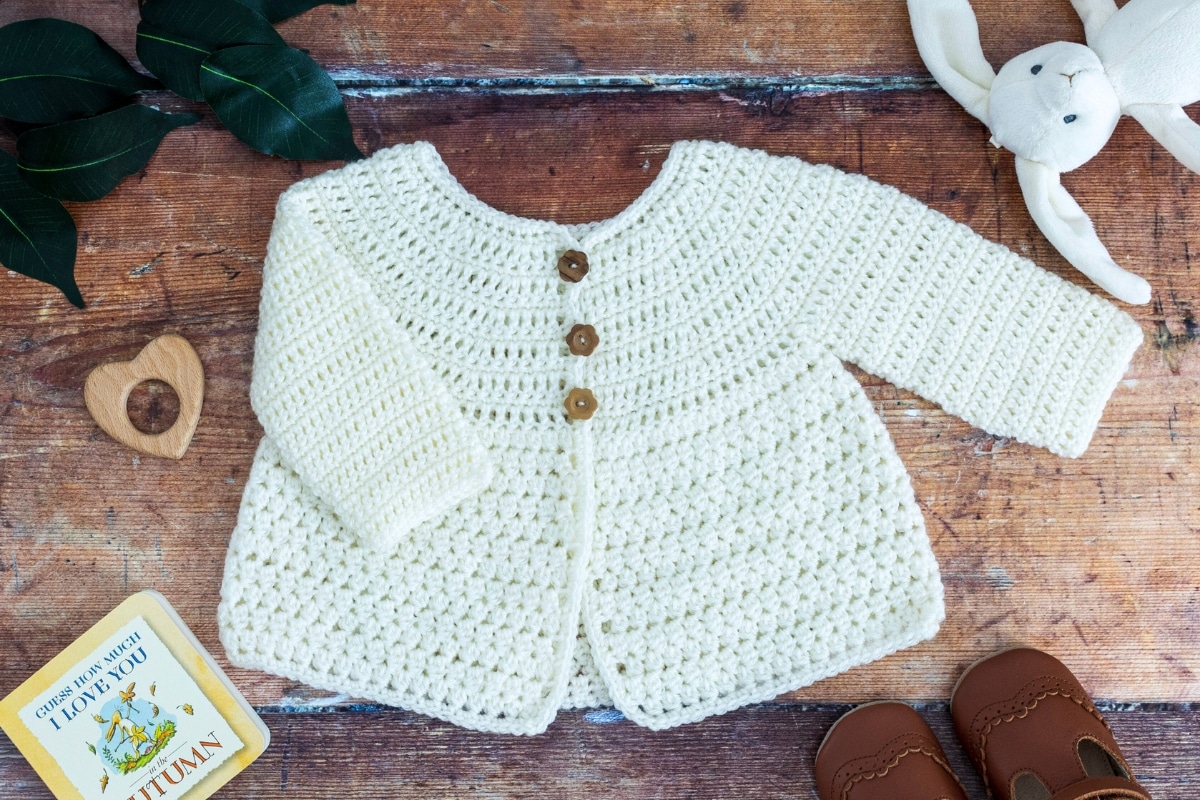 crochet baby cardigan pattern made with cream DK yarn beginner friendly