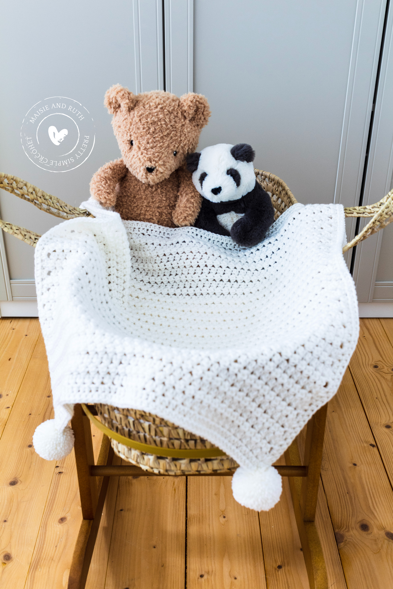 Crochet An Easy Baby Blanket with bear and panda in bassinett