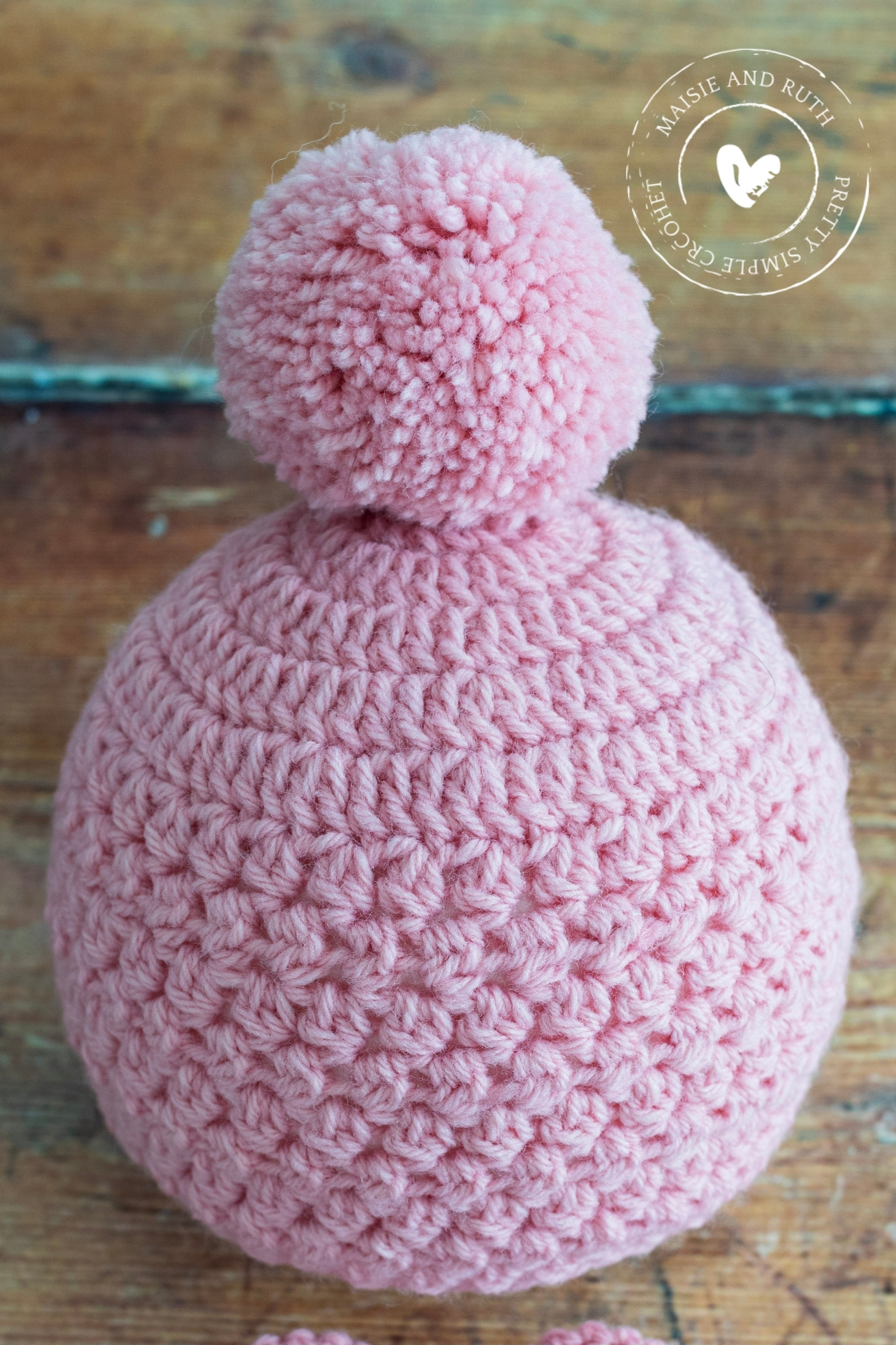 How To Attach A Pom Pom to a Hat Pink Baby Hat