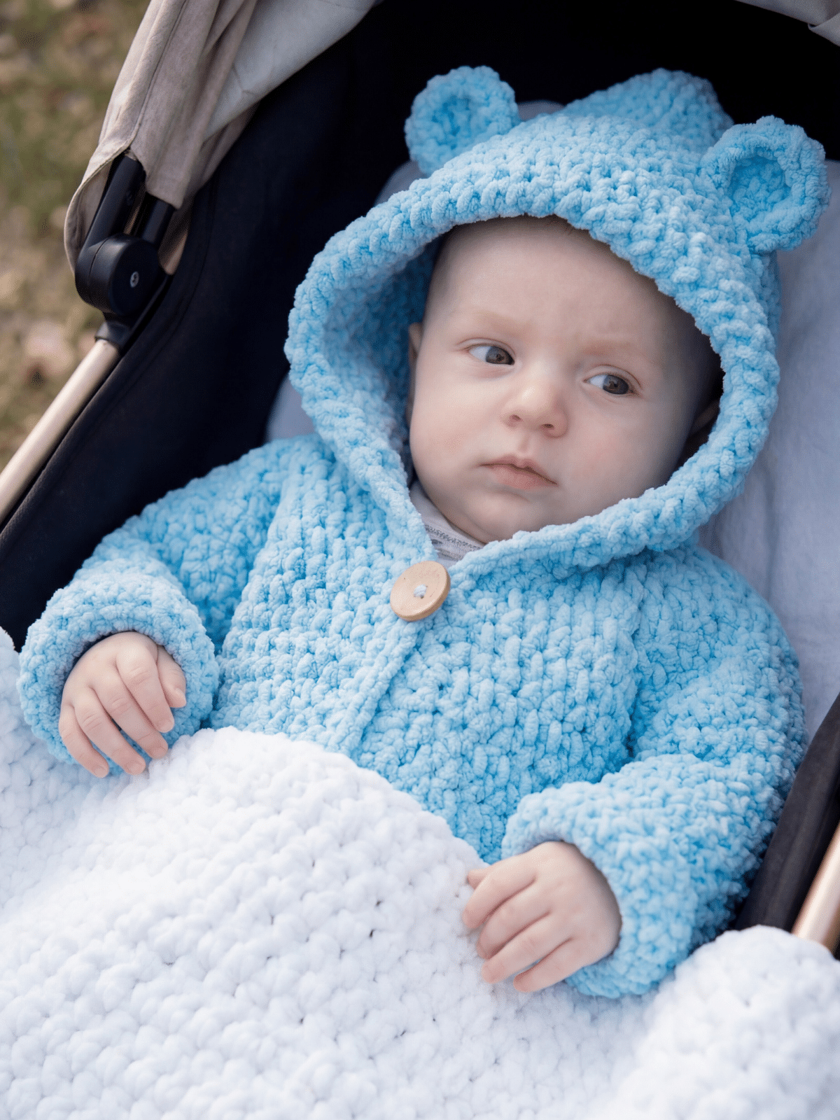 crochet baby hoodie worn by baby boy