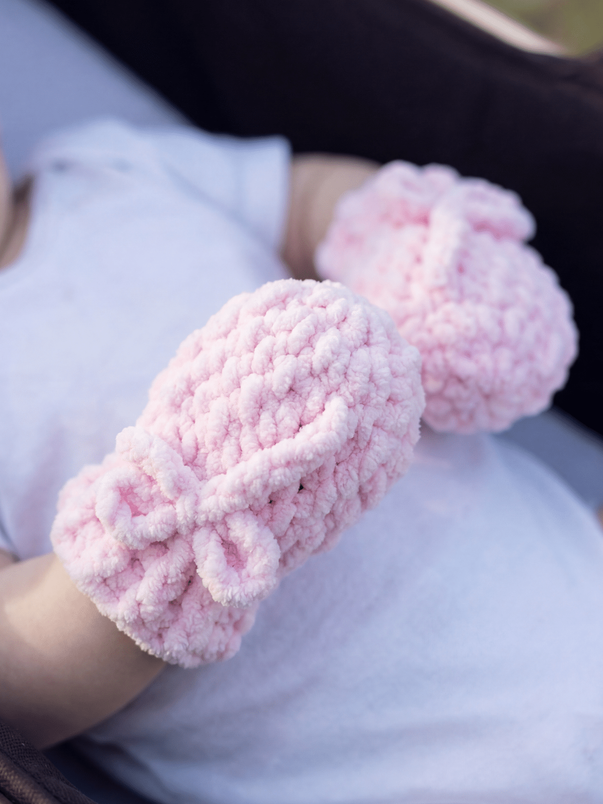 pair of fast crochet baby mittens with ribbed cuff design worn on baby