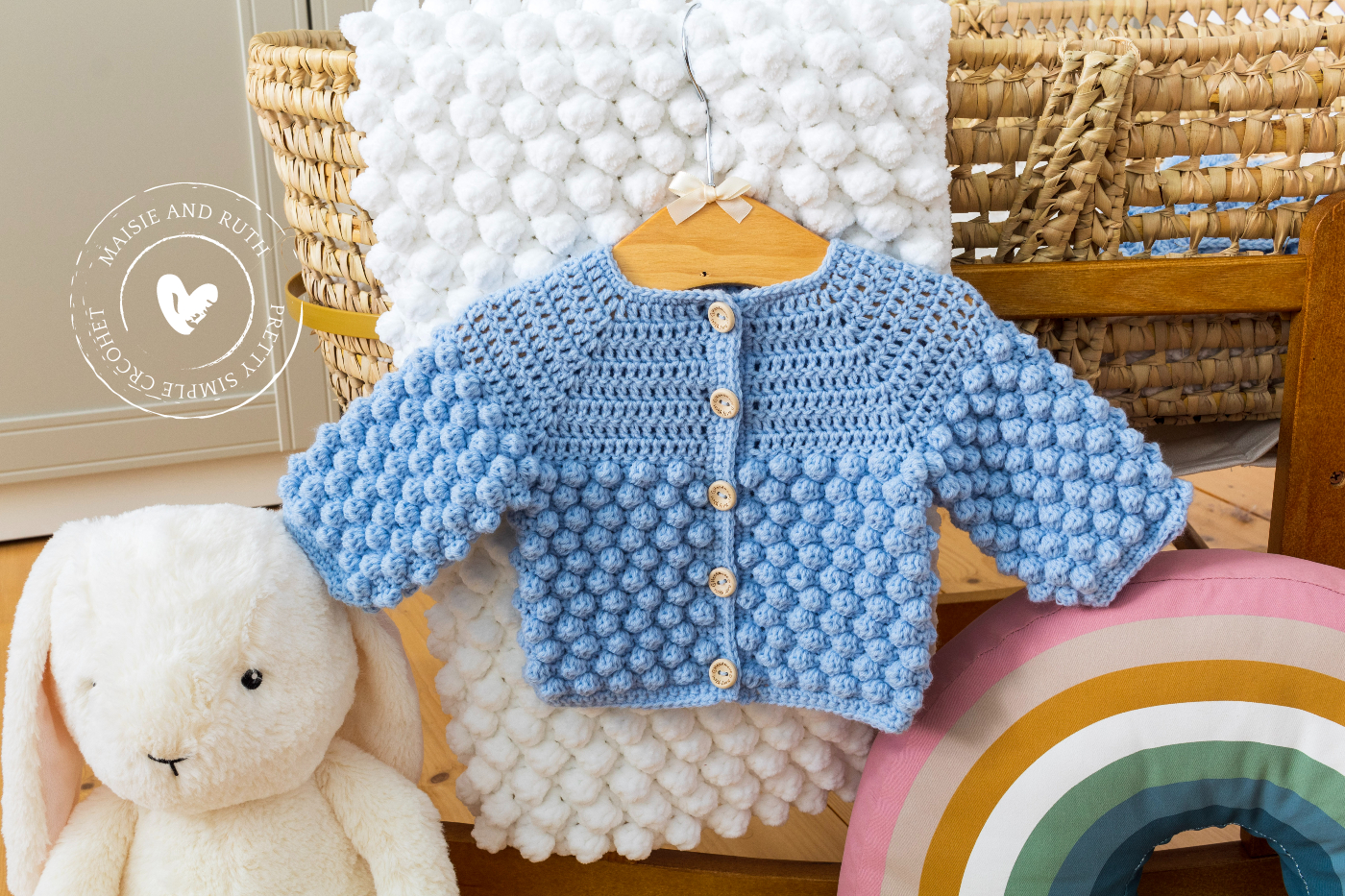 Bobble Crochet Baby Cardigan Pattern on display