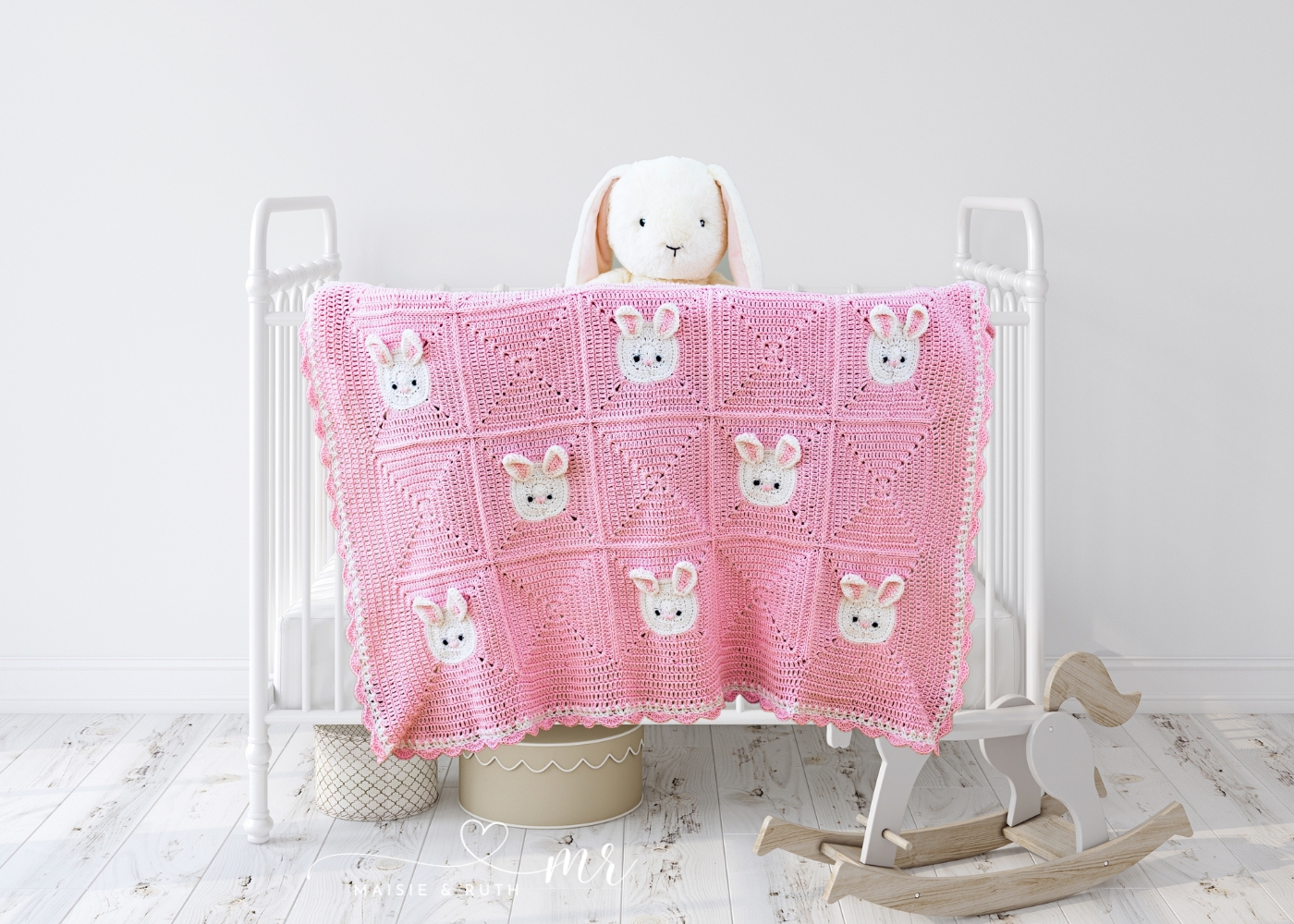 Bunny Crochet Baby Blanket Free Pattern hanging over white cot