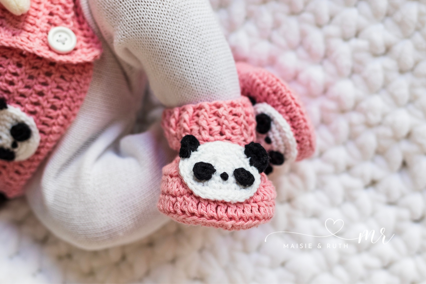 panda crochet baby booties on baby
