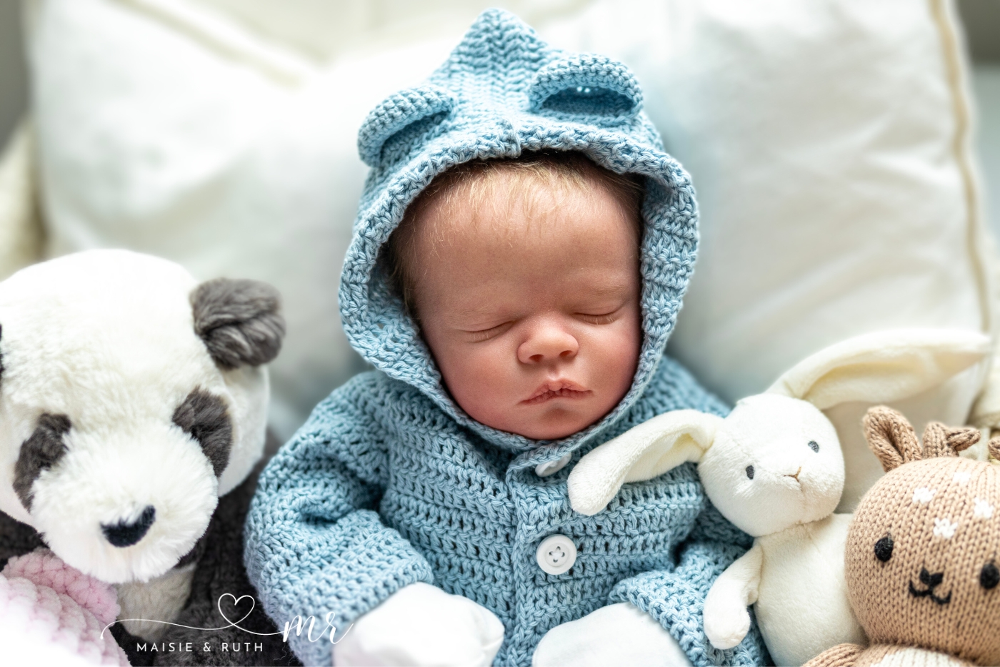 crochet panda baby hoodie free pattern made with blue yarn displayed on baby