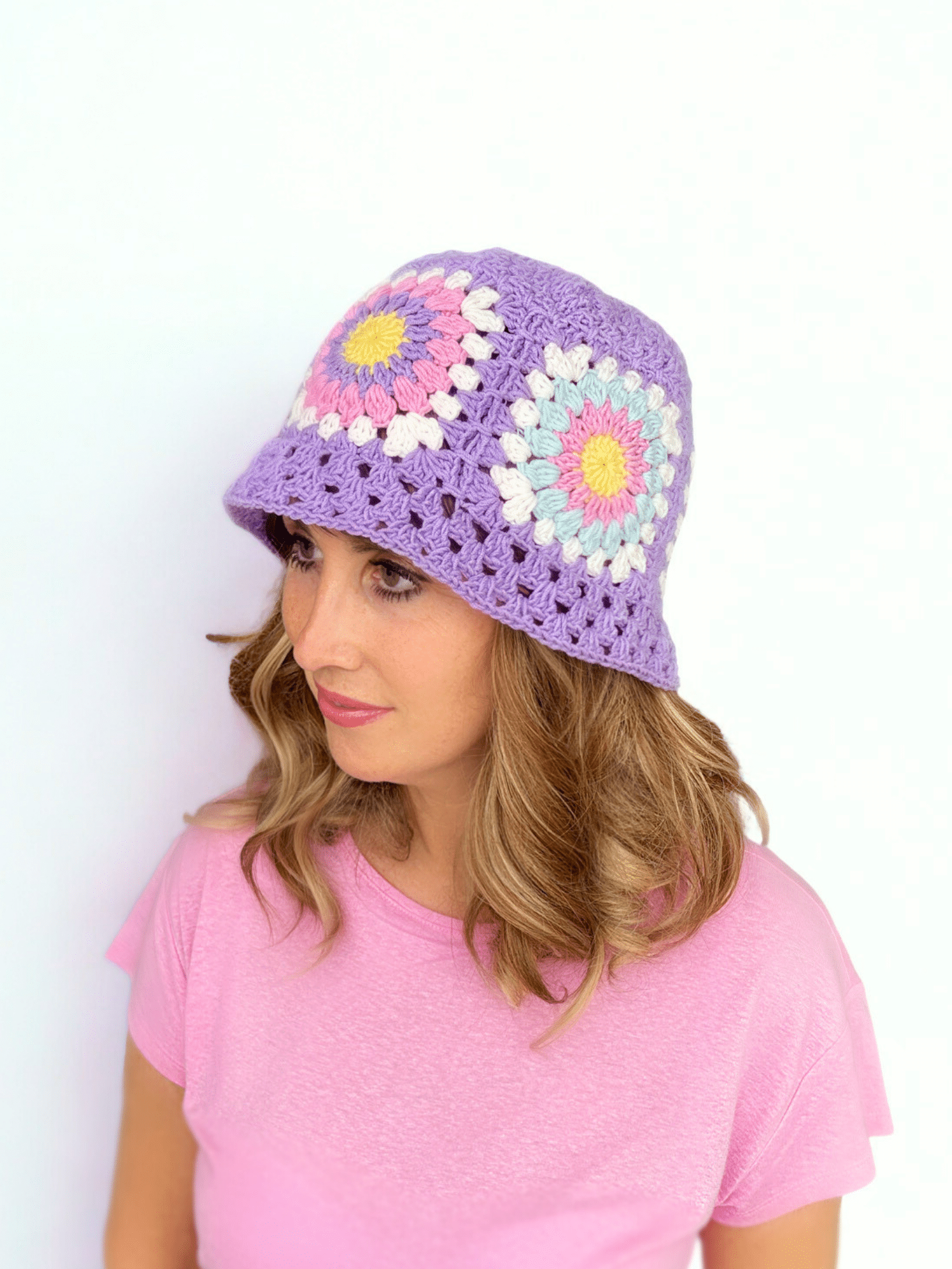 free crochet bucket hat pattern on smiling lady