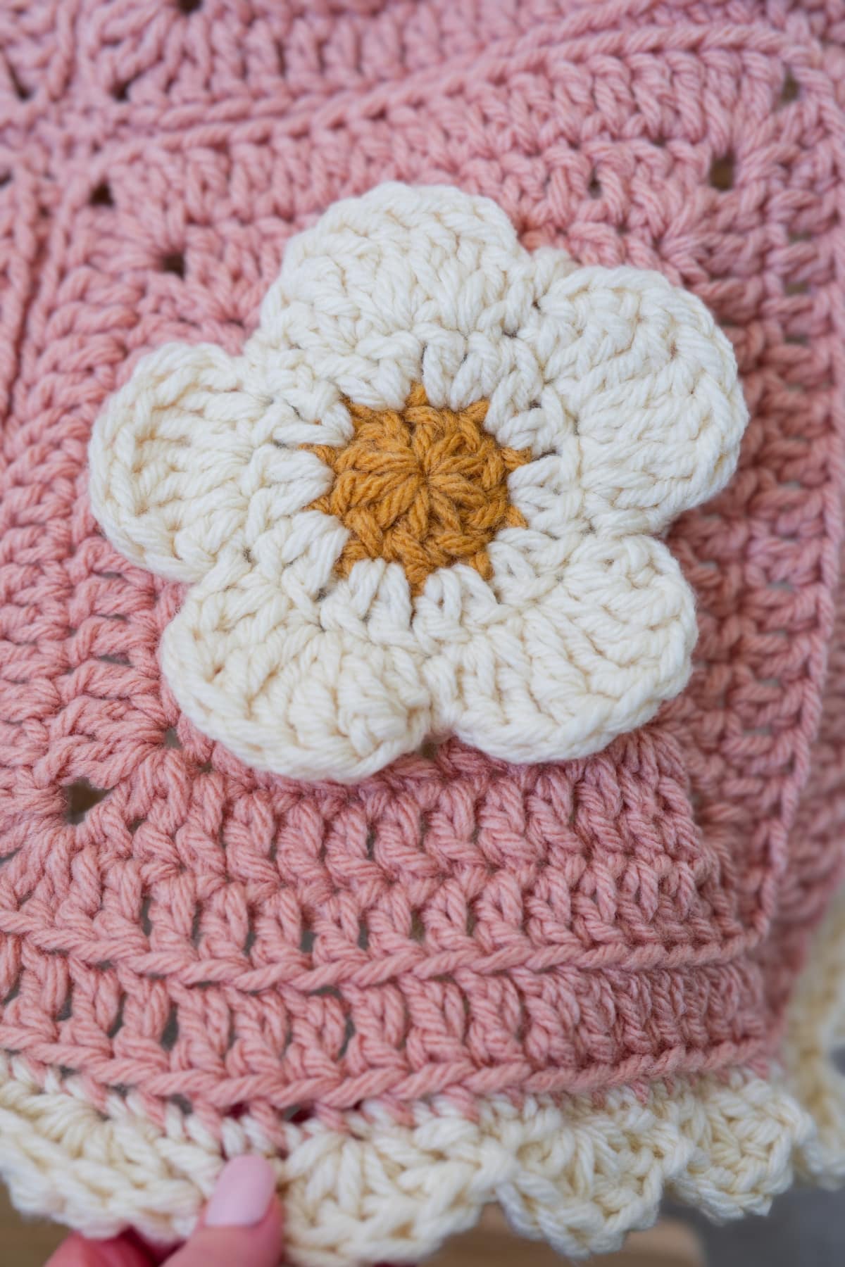 Crochet baby blanket square showing detailed petal stitches