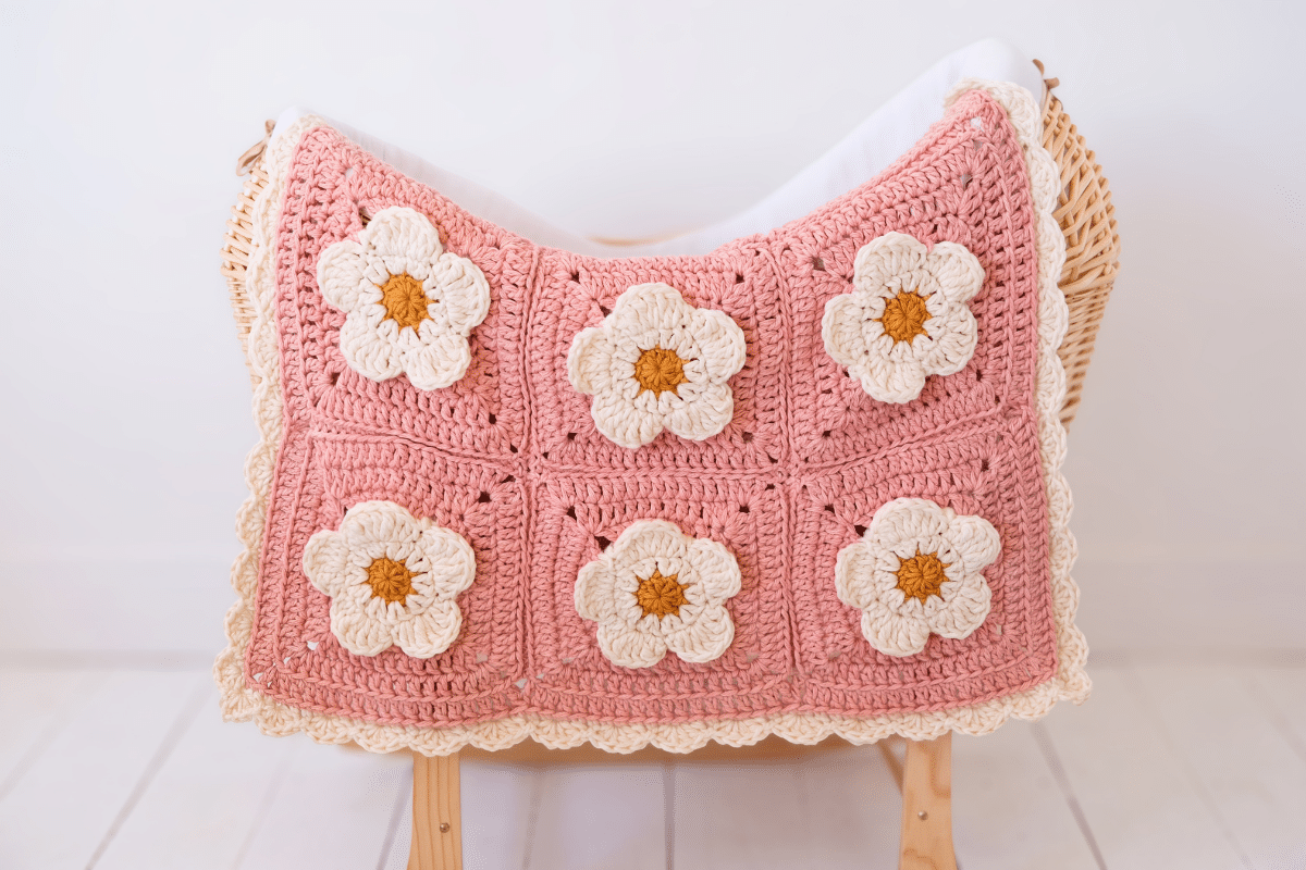 lion brand hue + me yarn used to make cozy petals baby blanket