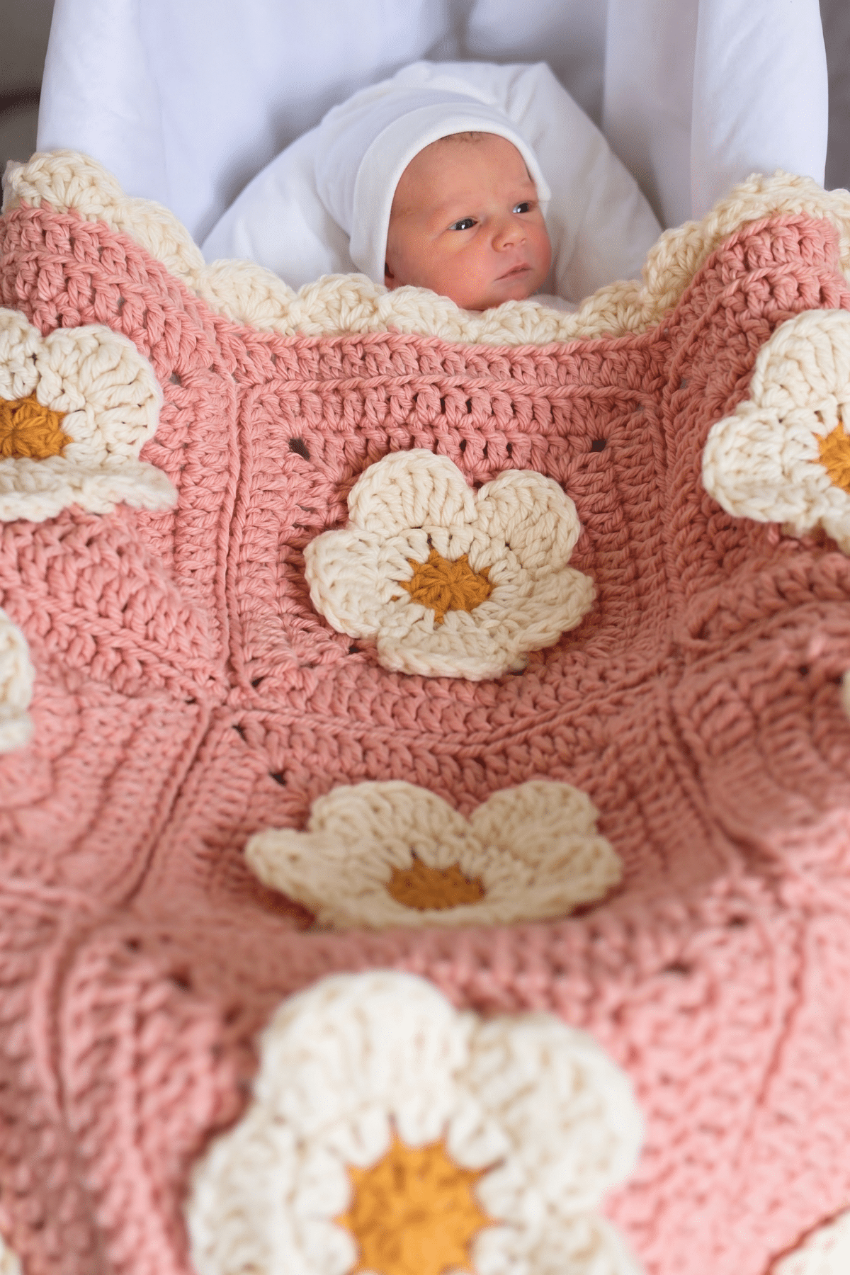 Handmade baby cozy petals blanket featuring modern flower granny squares in color rosewater